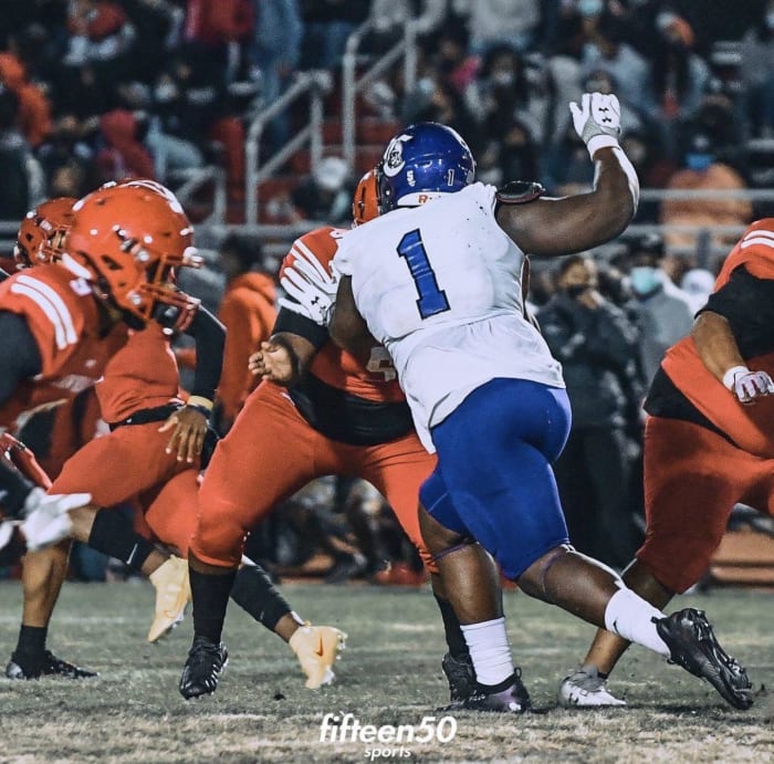 Wisconsin defensive line target Ashton Sanders doing a pass-rush move in a game during his junior year.
